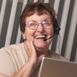 Older woman volunteer on the phone