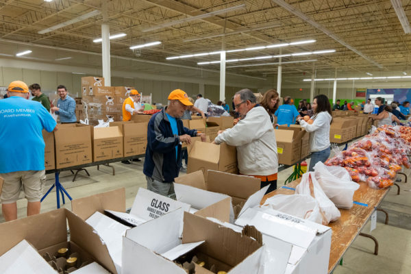 Volunteers packing food boxes