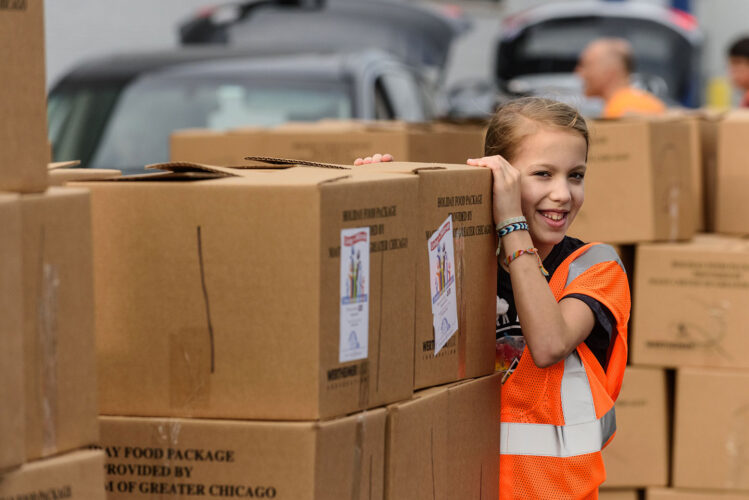 Volunteers packing food boxes