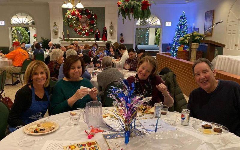 Holiday celebration. Groups of people at tables